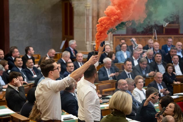 MPs hold flares in the Hungarian parliament