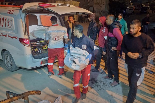 An ambulance carrying victims of an Israeli army strike arrives at the hospital in Khan Younis