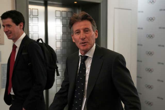 Candidate to the presidency of the International Olympic Committee Sebastian Coe arrives at the mixed zone during a break of the 144th session