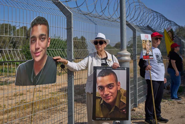 Varda Ben Baruch holds a picture of her grandson Edan Alexander