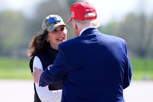 President Donald Trump greets Michigan Governor Gretchen Whitmer