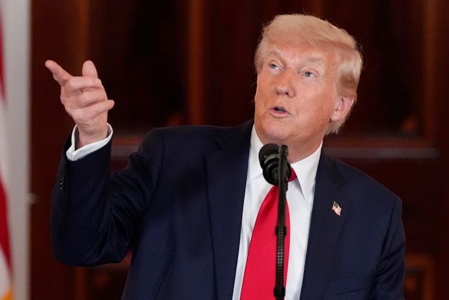 President Donald Trump speaks about investing in America in the Cross Hall of the White House