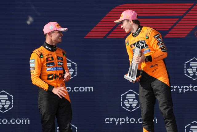 Lando Norris, left, and team-mate Oscar Piastrion the podium in Miami