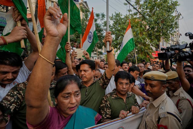 Indian National Congress workers hold Indian national flags in support of the Indian Army as they celebrate the success of ‘Operation Sindoor’, strike against Pakistan, in Guwahati on Friday