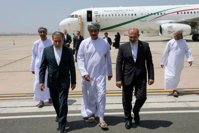 Iranian officials in the desert