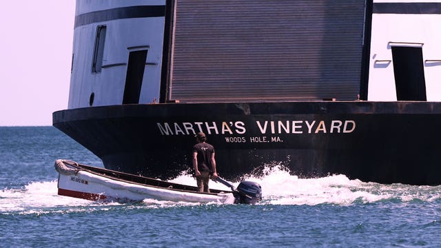 A man navigates the wake behind the Martha’s Vineyard Ferry