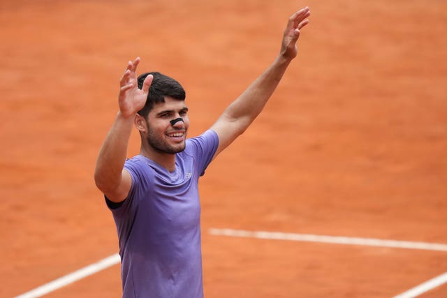 Carlos Alcaraz celebrates after defeating Karen Khachanov
