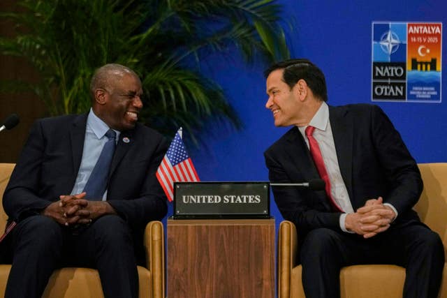 US secretary of state Marco Rubio, right, and Foreign Secretary David Lammy sit next to each other and smile at each other