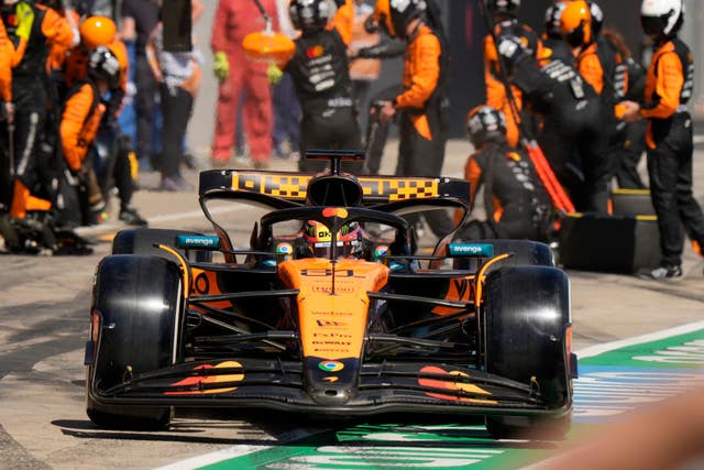 Oscar Piastri steers his car after a pit service