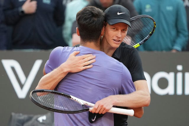 Jannik Sinner (back) embraces Carlos Alcaraz of Spain during the final of the Italian Open 