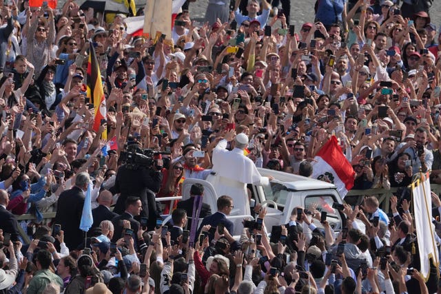 The Pope waves from the popemobile