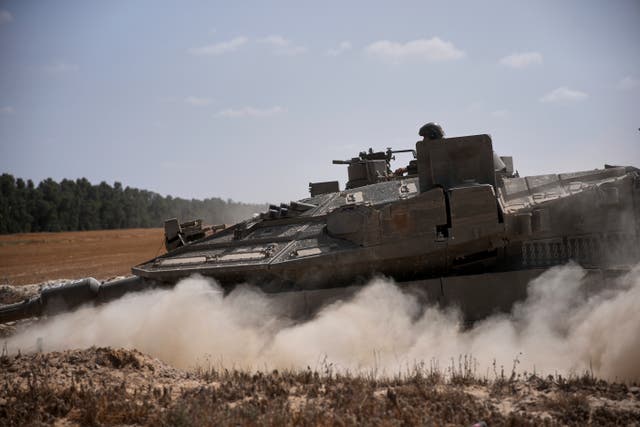 Israeli forces move along the border with the Gaza Strip