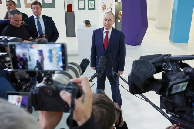 Vladimir Putin speaking to journalists