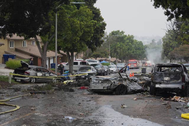 A street filled with burnt out cars