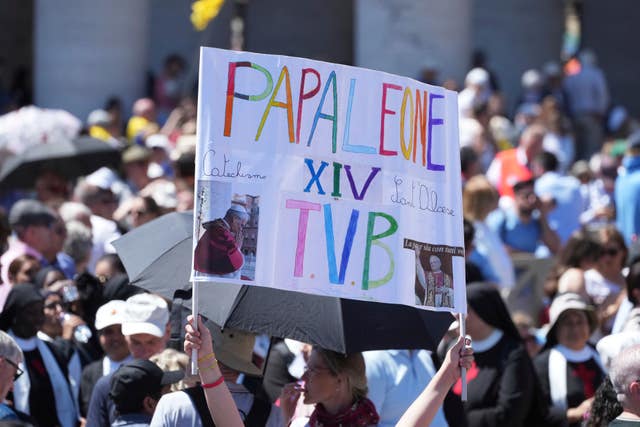 A banner reading 'Pope Leo I love you'