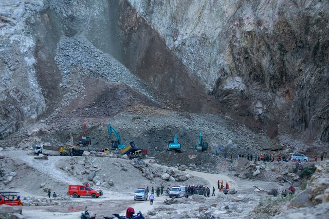 Rescuers search for people working at a quarry in Indonesia