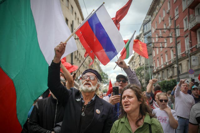 A protester holding a Russian flag