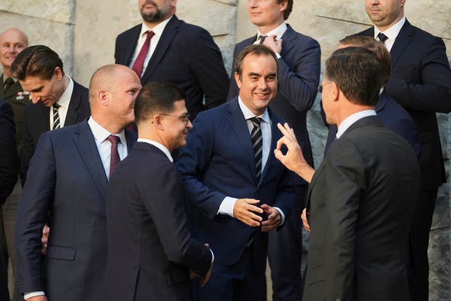 Sebastien Lecornu, centre, speaks with Nato secretary general Mark Rutte, second right, at the agency's headquarters earlier this year 