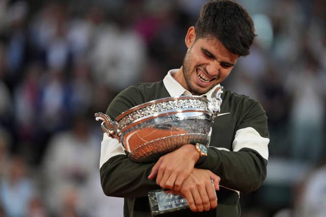 Spain’s Carlos Alcaraz celebrates with the trophy