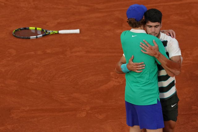 Carlos Alcaraz and Jannik Sinner embrace