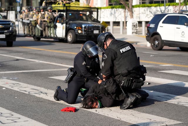 Los Angeles police officers arrest a protester 