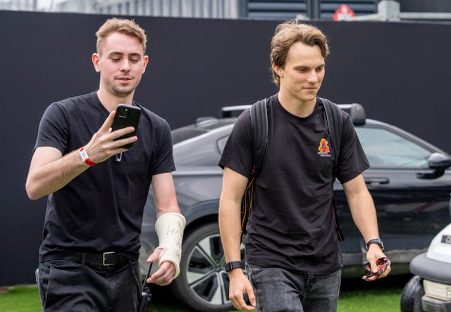 McLaren driver Oscar Piastri (right)
