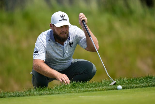 Tyrrell Hatton lines up a putt