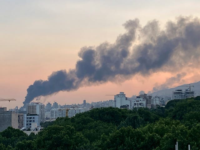 Smoke rises from the building of Iran’s state-run television after an Israeli strike in Tehran