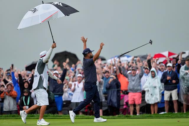 J.J Spaun celebrates his mammoth putt