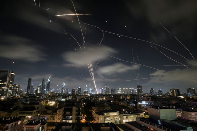 The Israeli Iron Dome air defence system fires to intercept missiles during an Iranian attack over Tel Aviv early on Wednesday