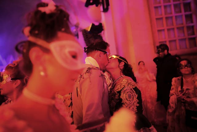 Costumed guests attend the Great Masked Ball