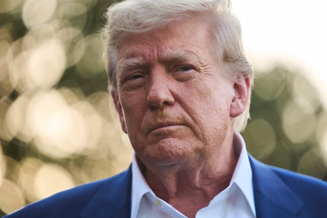 President Donald Trump speaks with reporters