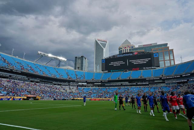 Players walk off the field for a weather delay during the Club World Cup round of 16 soccer match between Benfica and Chelsea in Charlotte, North Carolin