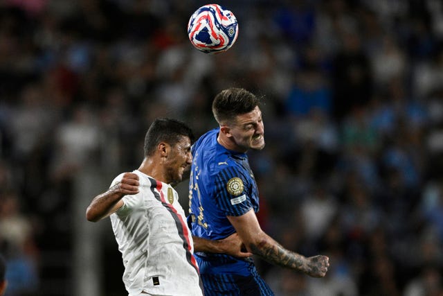 Manchester City’s Rodri competes for the ball with Al-Hilal’s Sergej Milinkovic-Savic at the Club World Cup