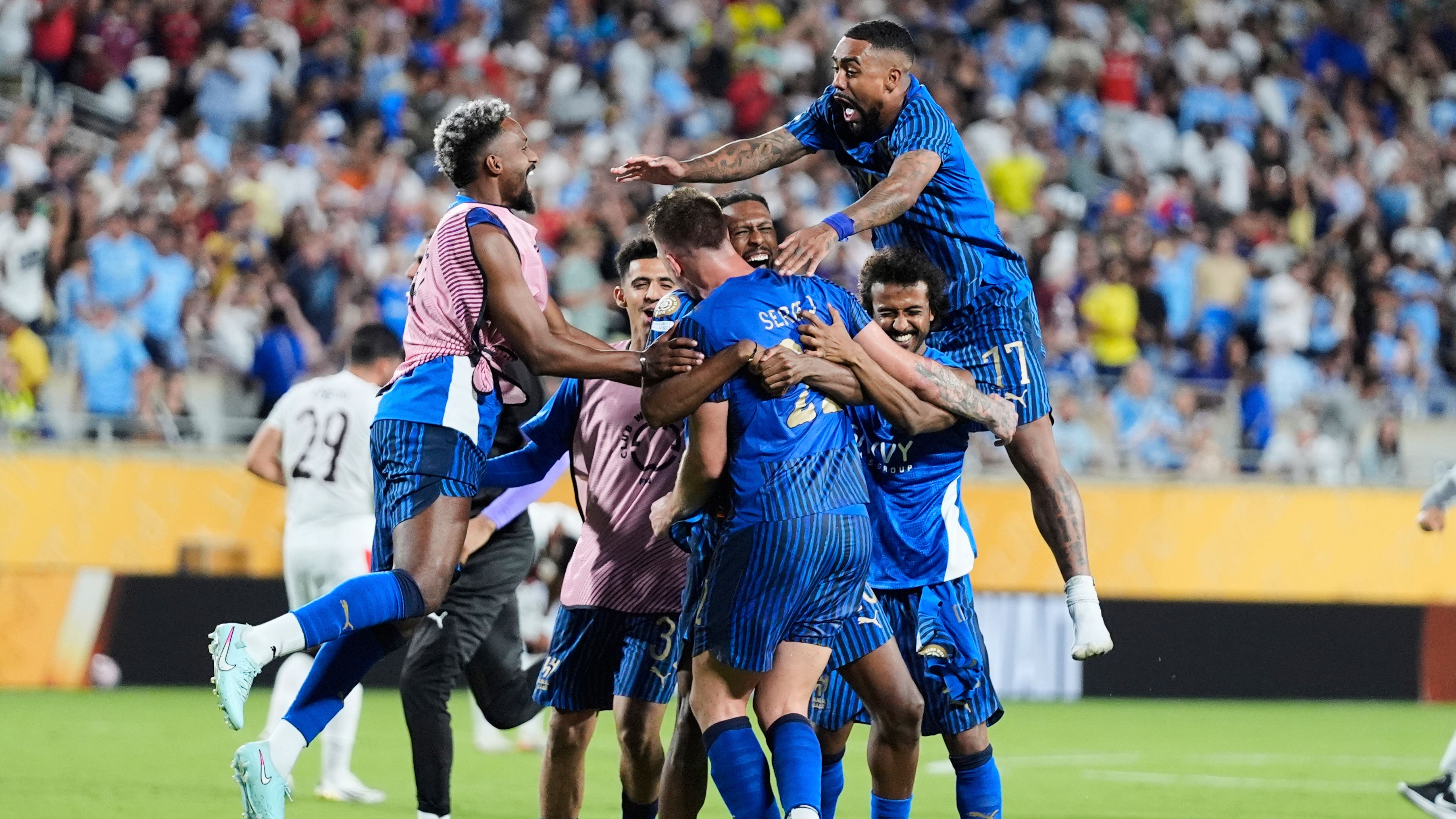 Al-Hilal’s players celebrate after beating Manchester City (John Raoux/AP)