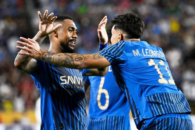 Al-Hilal’s Malcom is congratulated by Marcos Leonardo
