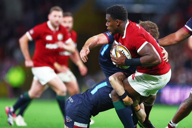 Maro Itoje is tackled defender during the Lions' game against the Queensland Reds
