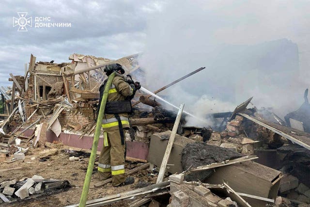 Emergency services work to extinguish a fire following a Russian attack in the Donetsk region of Ukraine