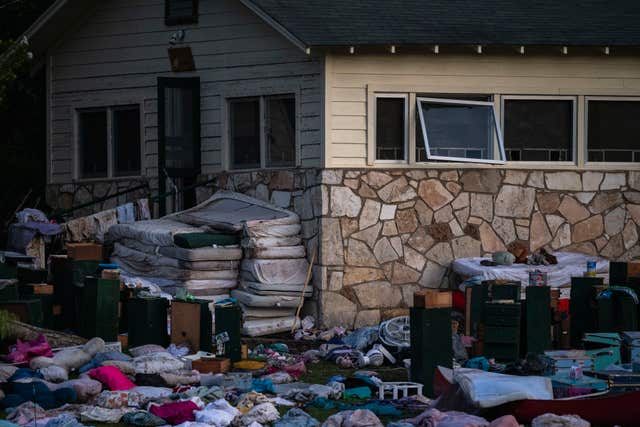 Campers' belongings outside a Camp Mystic cabin 