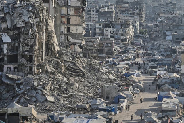 Tents sheltering displaced Palestinians amid war-damaged infrastructure in Gaza City