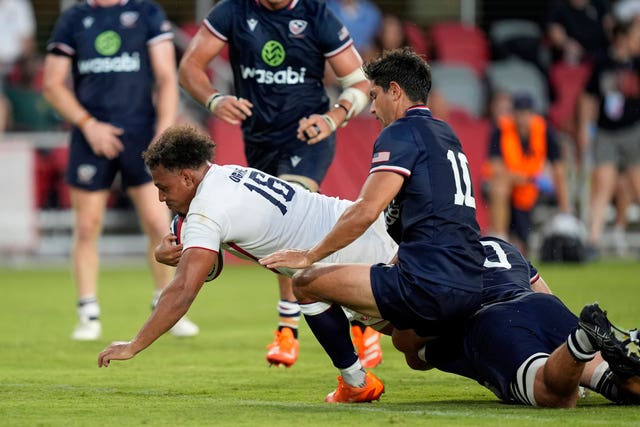 England’s Gabriel Oghre, left, breaks through to score
