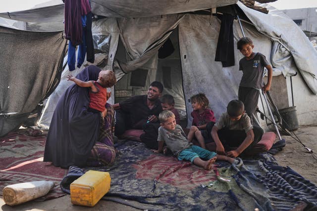 Palestinians family in a makeshift camp
