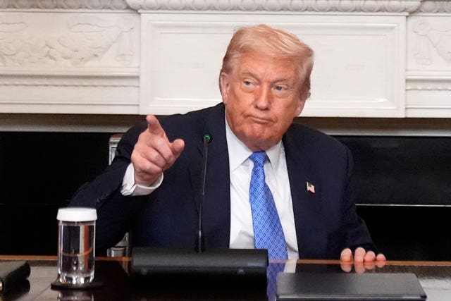 President Donald Trump gestures during a trilateral signing ceremony with Armenian Prime Minister Nikol Pashinyan and Azerbaijan President Ilham Aliyev in the State Dining Room of the White House, Friday, Aug. 8, 2025, in Washington