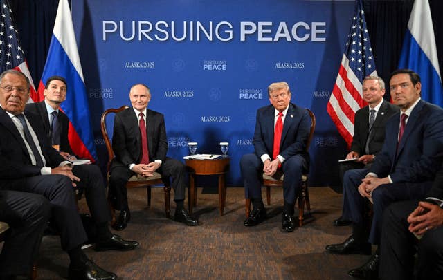 US President Donald Trump, centre right, with Russia’s President Vladimir Putin, centre left 