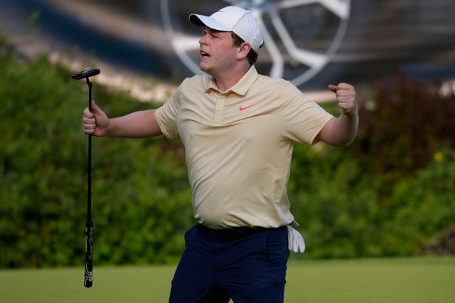 Bob MacIntyre celebrates making a putt