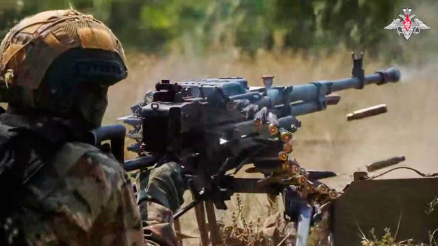 A Russian soldier fires during a practice at a training ground on an undisclosed location in Ukraine 