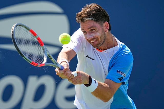 Cameron Norrie hits a backhand