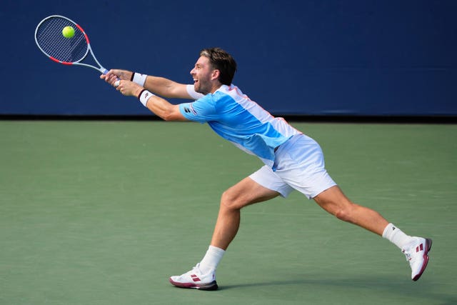 Cameron Norrie stretches for a backhand 