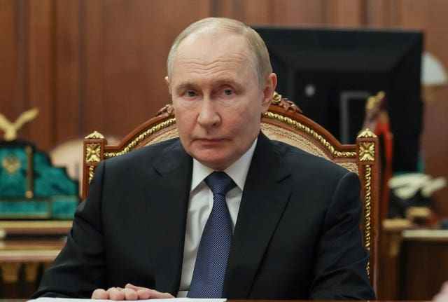 Russian President Vladimir Putin attends a meeting with members of the government at the Kremlin in Moscow, Russia