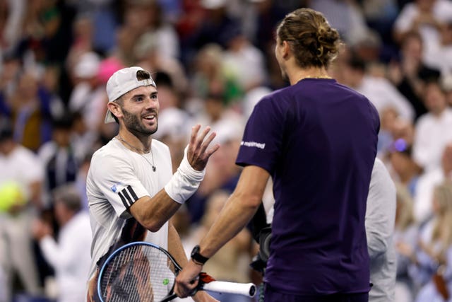 Alexander Zverev, right, shakes hands with Jacob Fearnley